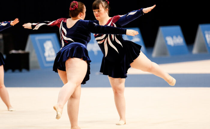 two women performing gynastics